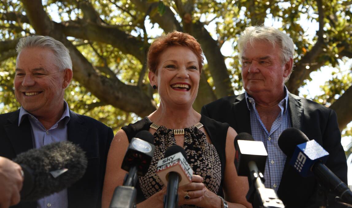 One Nation's South West upper house candidate Colin Tincknell, Senator Pauline Hanson and Mandurah candidate Doug Shaw face the media scrum at the Eastern Foreshore on Monday. Photo: Marta Pascual Juanola.