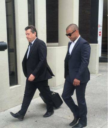 Former Eagle Daniel Kerr (right) arrives at the Perth Magistrates Court. Photo: Caitlin Barr, 6PR