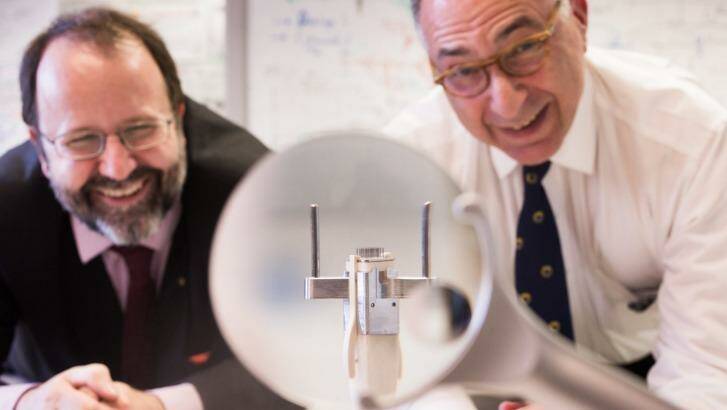 Arthur Lowery and Jeffrey Rosenfeld with a 9mm ceramic tile central to their bionic eye project. Photo: Simon Schluter