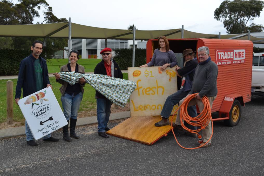 Home at last: Marketeers Eric Brahim, Katrina Lombardo, Ian Parmenter, Michaela Langeder, Mike Thompson and Jean Mare Jacob unpack their donated trailer at TAFE.