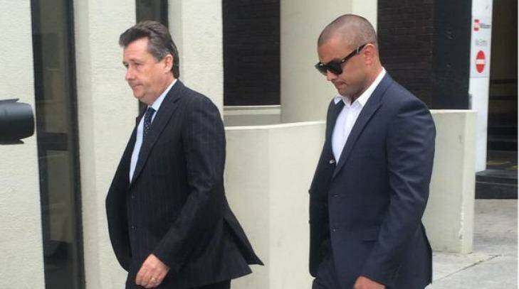 Former Eagle Daniel Kerr (right) arrives at the Perth Magistrates Court. Photo: Caitlin Barr, 6PR