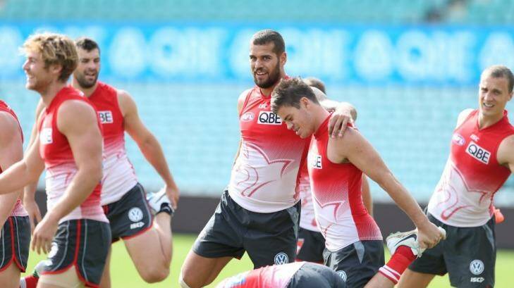 Sydney Swans forward Buddy Franklin warms up with his teammates at training on Thursday. Photo: Anthony Johnson