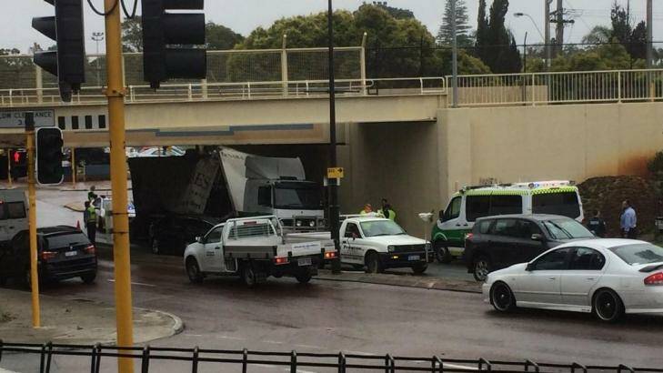 The truck gets stuck under the bridge in Bayswater. Photo: Katelyn Sinclair