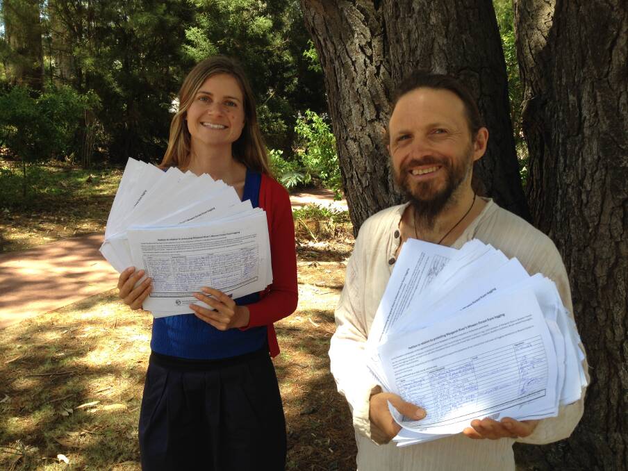 Hope for council endorsement: Save Mowen Forest representatives Naomi Godden and David Rastrick with the petition pages that boast more than 1600 signatures. Story, page 2.