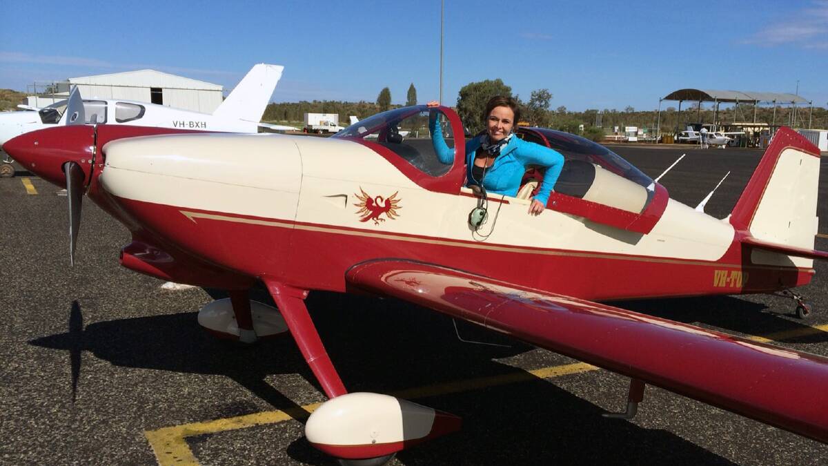 Full of purpose: Marie Louise in the two-seater plane taking her around Australia to raise the awareness of campaigns against violence directed at women and children.