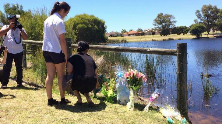 Flowers laid out by a Landsdale lake in tribute to Sam Trott. Photo: Chenee Marrapodi