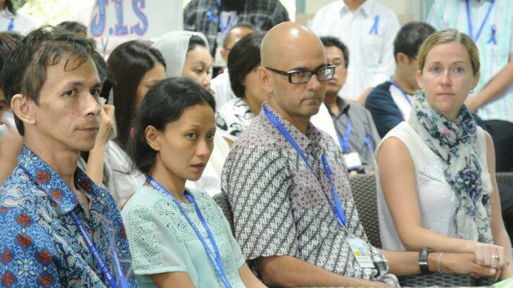 Two teachers held by Indonesian police without charge: Ferdinant Tjiong (left) with his wife, Fransisca, and Neil Bantleman, with his wife Tracey. Photo: Michael Bachelard
