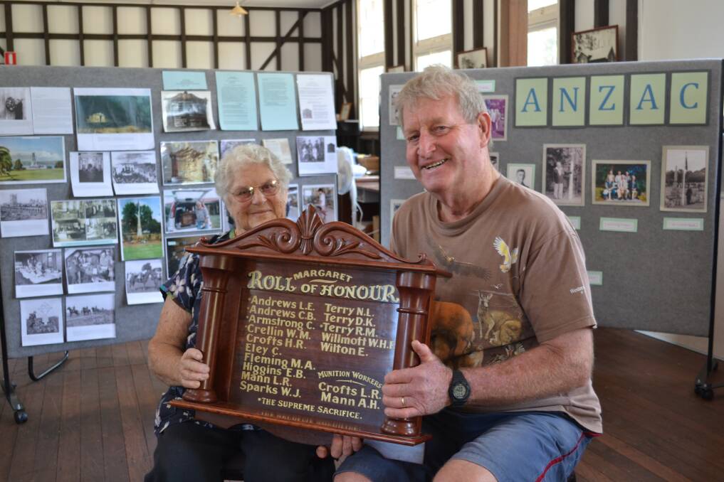 Good as old: Pat Gray and John Alferink of the Margaret River and Districts Historical Society present the town s Roll of Honour replica.