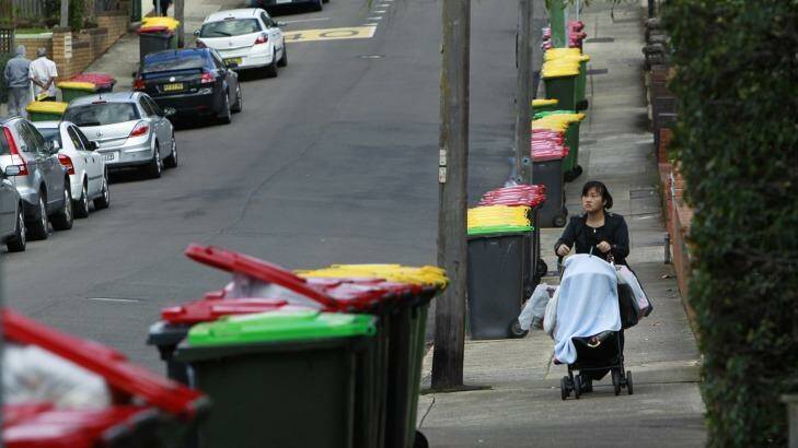 Bins line the street after Transpacific pulled its trucks off the road for safety reasons.  Photo: Louise Kennerley
