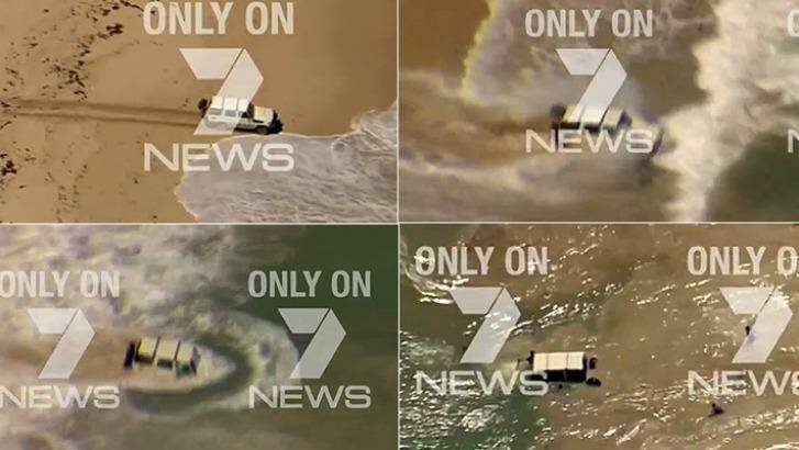 The Toyota straight into the waves, forcing the the offenders to climb out of the window. Photo: 7 News