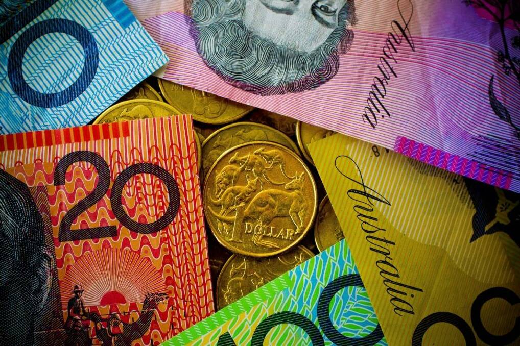 The Australian dollar is headed for further falls, according to Roubini Global Economics. Photo: Glenn Hunt