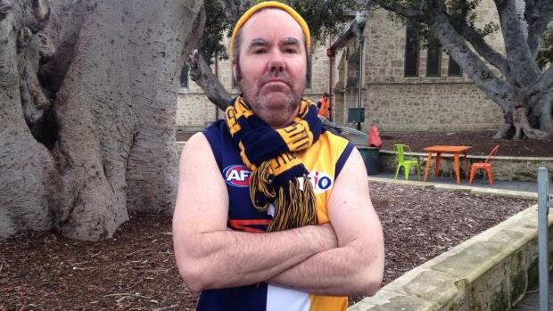 Blue-and-gold steel: Brendan Foster proudly sports Eagles colours deep in Freo territory. Photo: James Mooney.