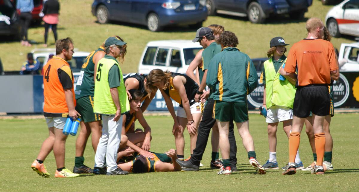Augusta-Margaret River's Jake Rodgers was punched to the ground after the final siren. Photo: Andrew Elstermann. 