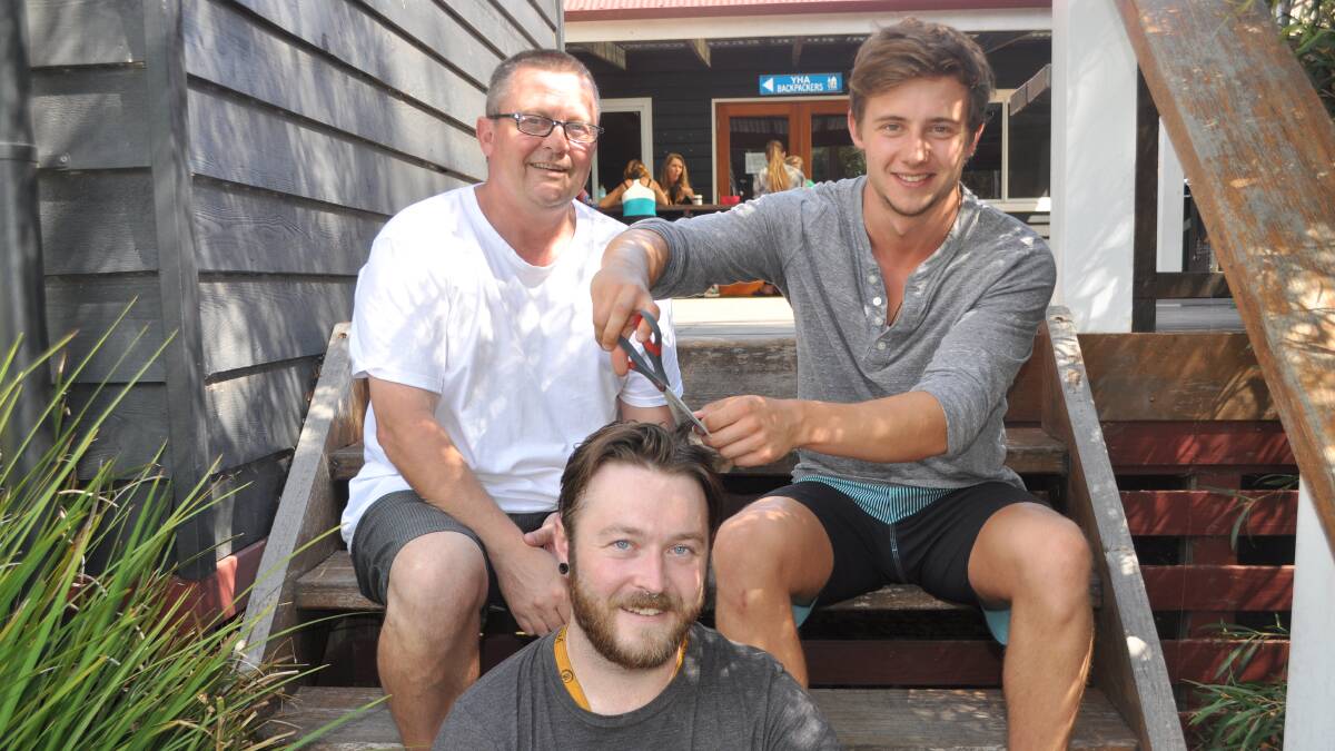 Helping find a cure: Backpackers manager Paul Harris with Chris Jaunzemis and Huw Morgan are ready for the shave.