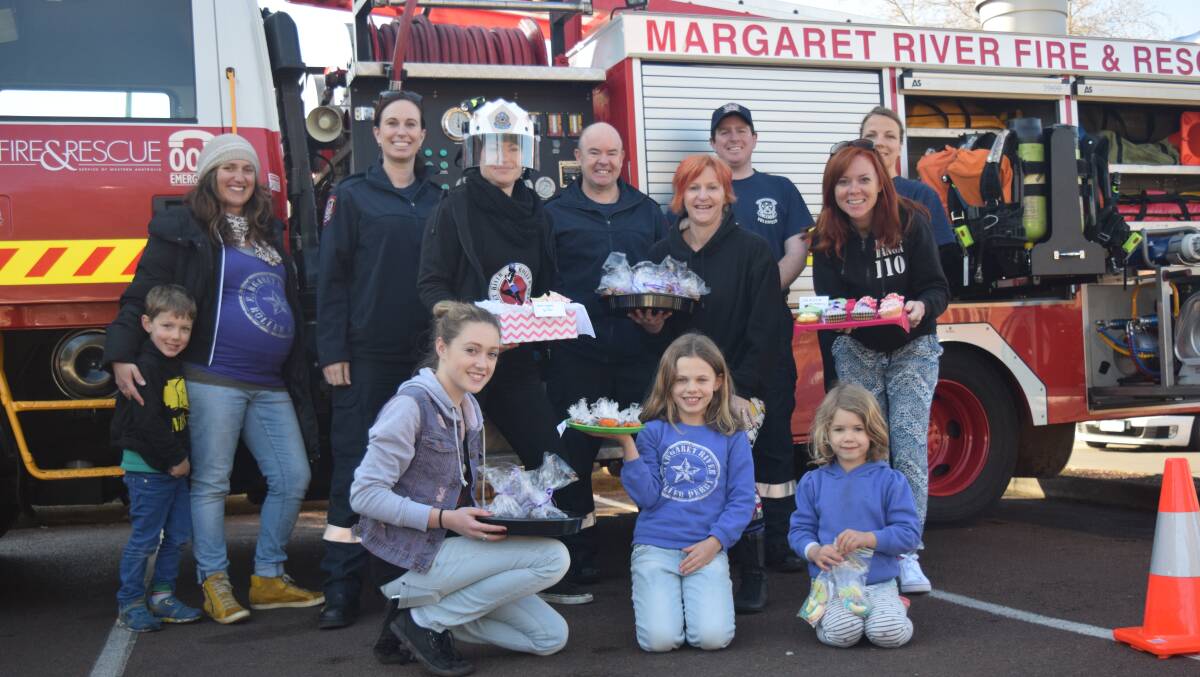 The Margaret River Volunteer Fire and Rescue Service brought along their truck to help the girls sell their baked goods for the cause.