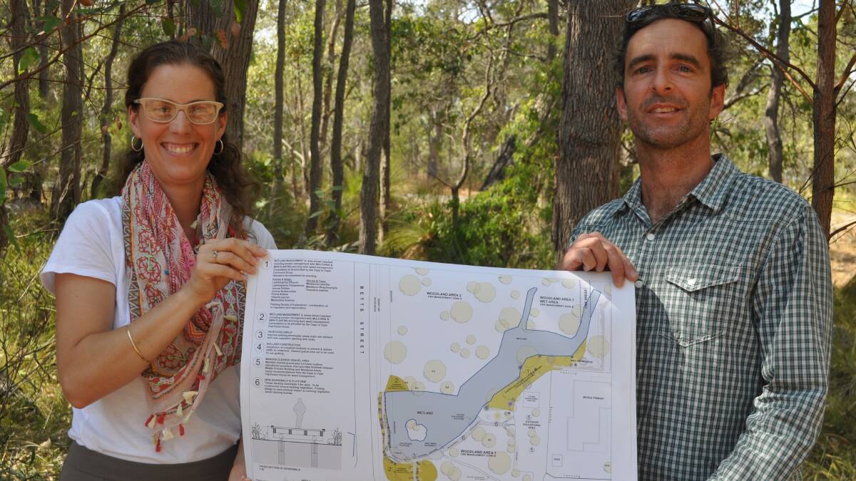 Wetland restoration: Principal Lisa Fenton and school council chairperson Frank Pethica hold the designs for the boardwalk in front of its future wetland home.