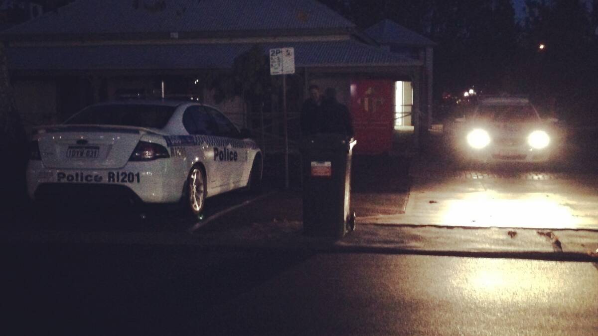 Police attend to Vasse MLA Troy Buswell's electorate office on Tuesday night after a letter containing a suspicious white powder was found.