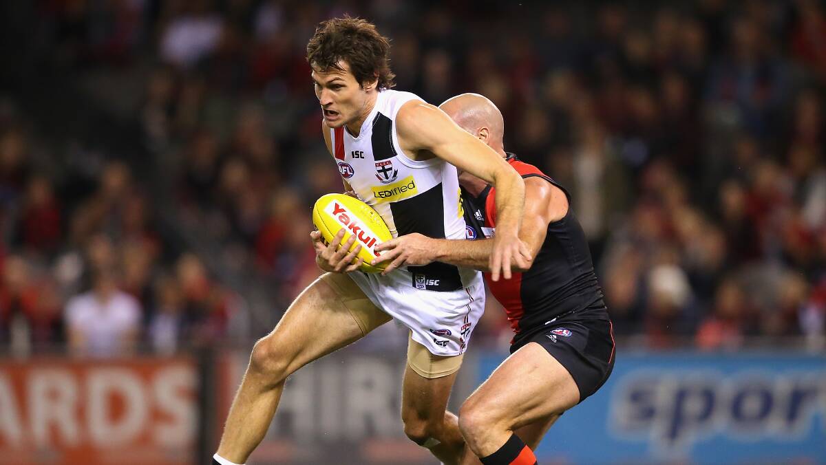  Farren Ray of the Saints is tackled by Paul Chapman of the Bombers during the round five AFL match between the Essendon Bombers and the St Kilda Saints at Etihad Stadium on April 19, 2014 in Melbourne, Australia. Photo: Quinn Rooney/Getty Images.
