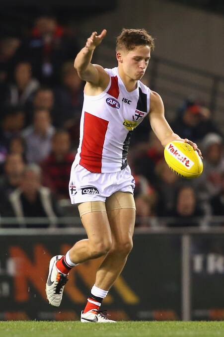  Jack Billings of the Saints kicks during the round five AFL match between the Essendon Bombers and the St Kilda Saints at Etihad Stadium on April 19, 2014 in Melbourne, Australia. Photo: Quinn Rooney/Getty Images.