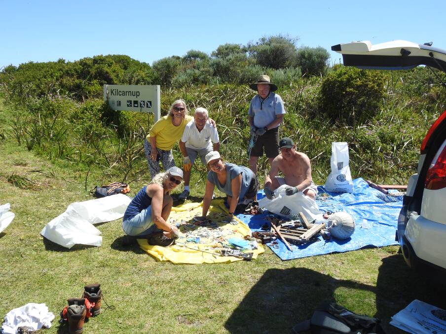 The Prevelly Penguins Joey's Nose crew sort through their collected litter. L:R Trish Yates, Hetty and Bryan Elliot, Laura Wenman, Jim McLachlan and Bryn Plant. Photo: Peter St Clair-Baker.