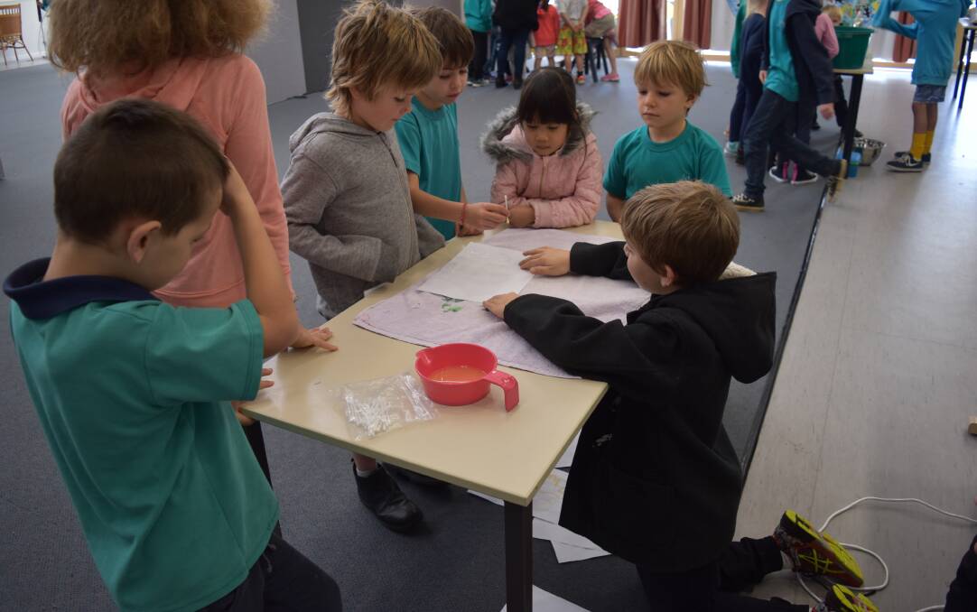 Students gathered at each station to learn more about their schoolmates' experiments during the whole-school science day. Photos: Nicky Lefebvre