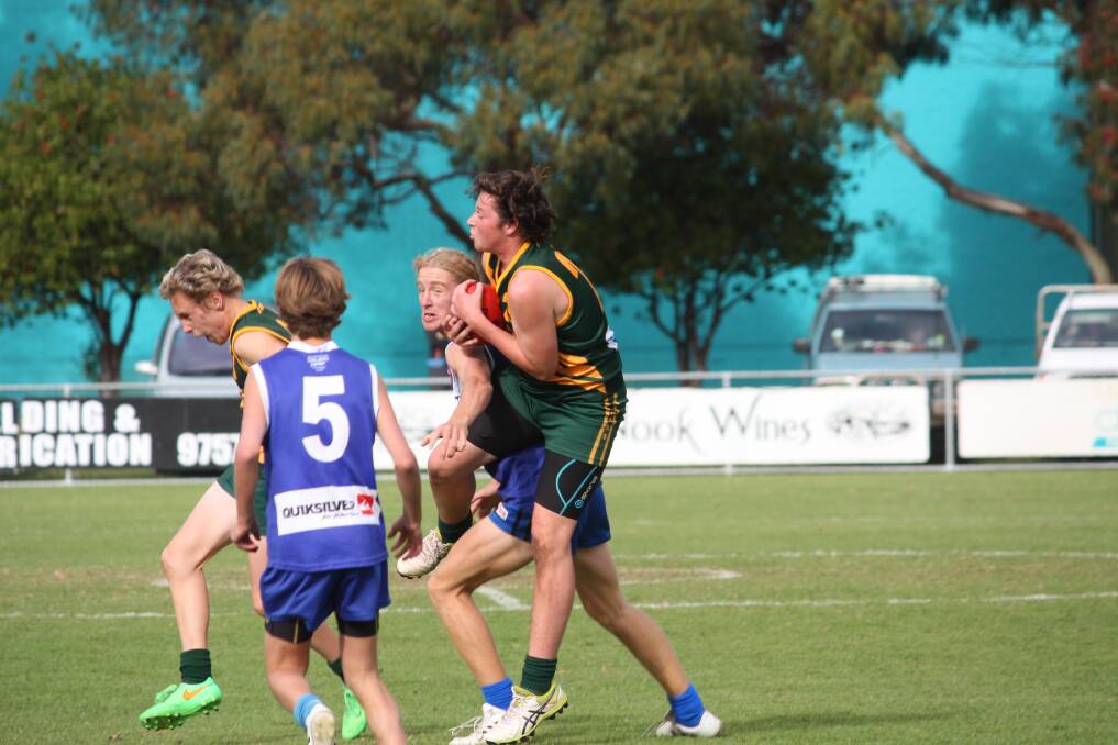 Skills: Kyah Sier takes a strong mark against his Dunsborough opponent. Photo: Supplied.