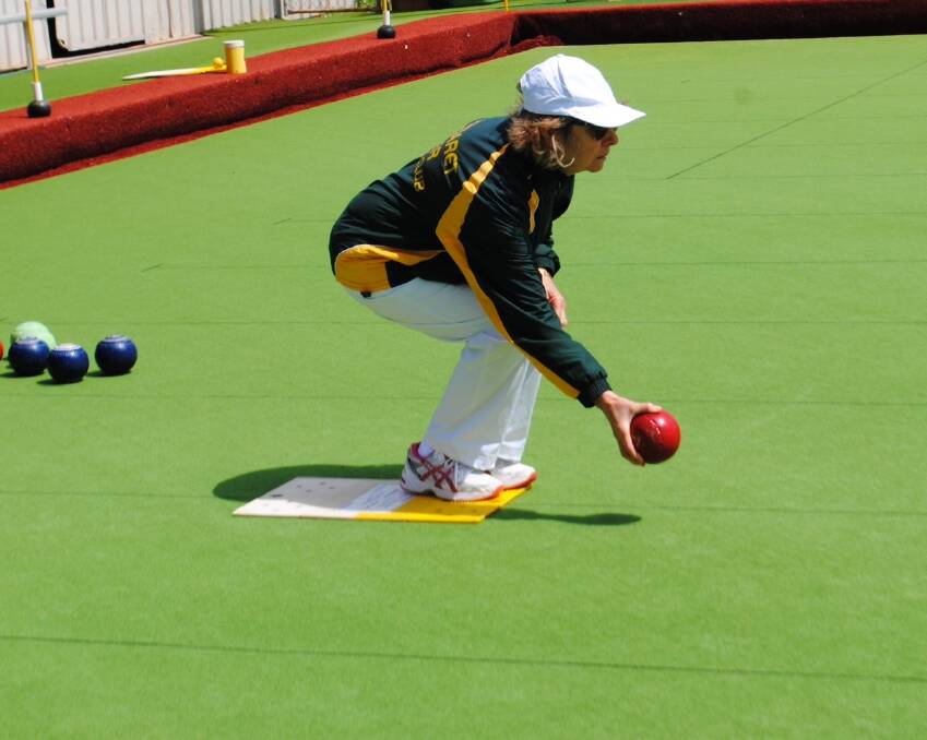 Concentration: Val Wyld braves the chilly conditions to take part in the club's season opening day over the weekend. Photos: Margaret River Bowling Club.
