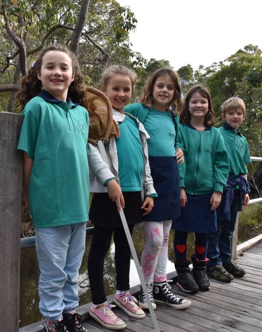 Giving thanks: Montessori students make sure the school's wetlands area is in tip top shape ready for this Saturday's open day. Photo: Nicky Lefebvre