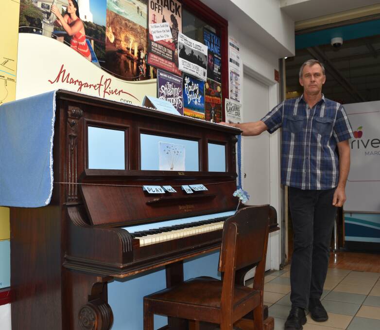 Music for all: Riverfresh IGA employee Peter Harker with the antique piano, which he hopes to bring back to the shopping complex regularly. Photo: Nicky Lefebvre