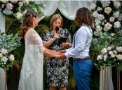 Celebrant Michelle Dobbs (centre) says registry weddings are becoming more popular as couples opt for simple, fuss-free ways to tie the knot. Pictures supplied. 