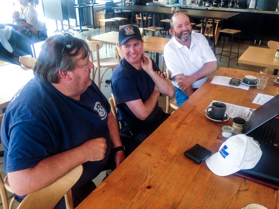 Talk of town: Leith Jones and Jess Bushby of the Margaret River Volunteer Fire and Rescue Service chat with Liberal candidate Ross Woodhouse on Sunday. Photo: Supplied.