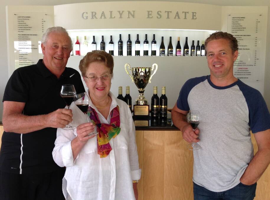 Top drop: Gralyn Estate proprietors Graham and Merilyn Hutton (left) celebrate with winemaker Dr Bradley Hutton. Photo: Supplied.