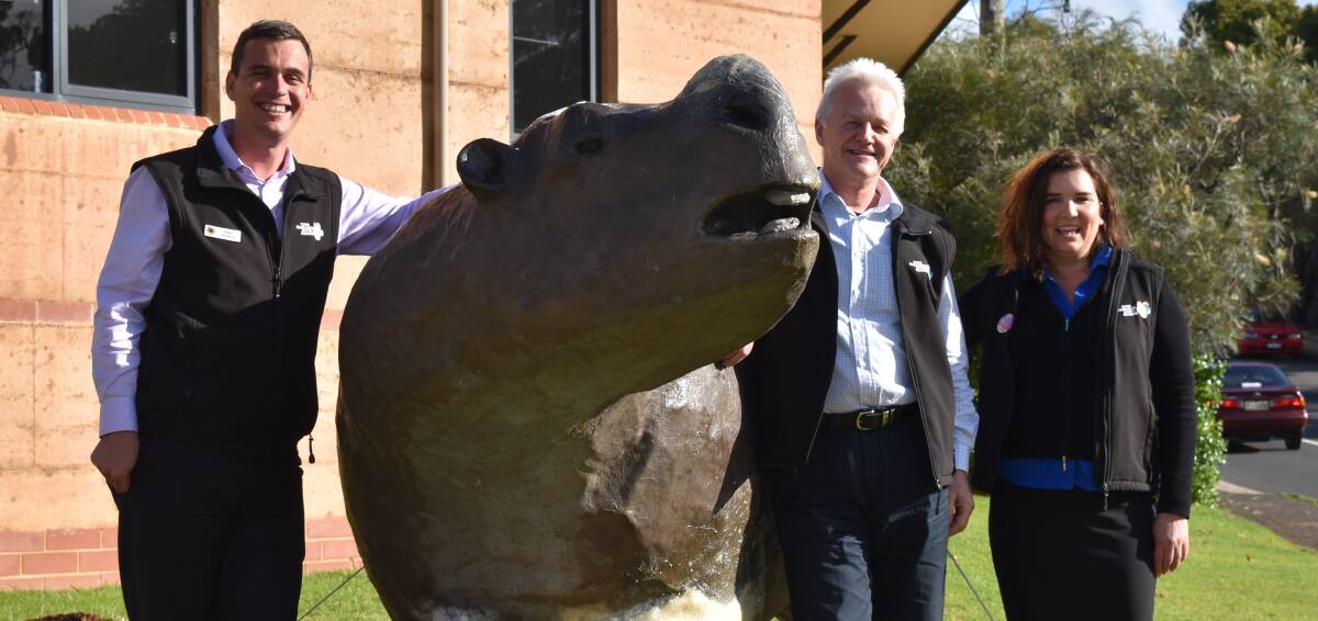 Home again: Matt Norton, Steve Harrison and Michelle Deighton celebrate with 'Zyggy' the zygomaturus at the Visitor Centre. Photos: Nicky Lefebvre and Maureen Campbell