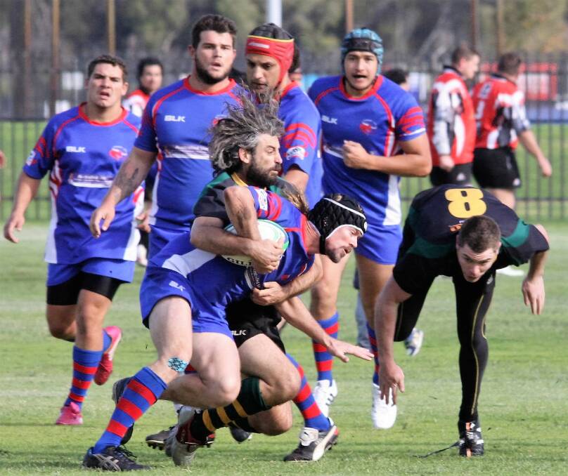 Takedown: The Margaret River Gropers Rugby Club continued their unbeaten run against the Bunbury Bulls over the weekend, with an emphatic 68-5 victory. Photo: Jack Carlsen.