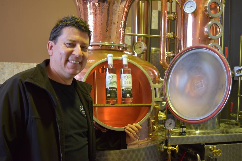 High spirits: James Reed with The Grove's new still and two of his award-winning spirits, Caribbean Spiced Rum and Absinthe. Photo: Nicky Lefebvre