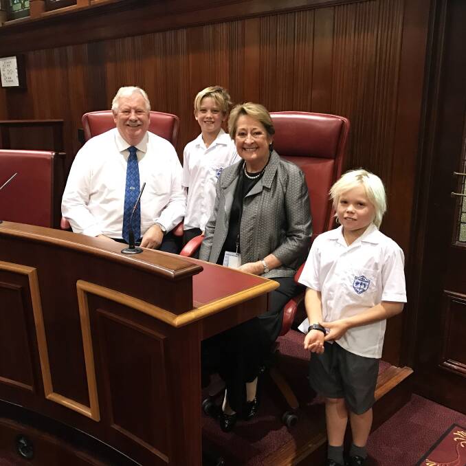 Seat of power: Tommy More student Tom Scott is flanked by his grandmother - former State MP Barb Scott OAM - and retiring South West MP Barry House, during a tour of State Parliament with classmate Joshua Willcox (right).