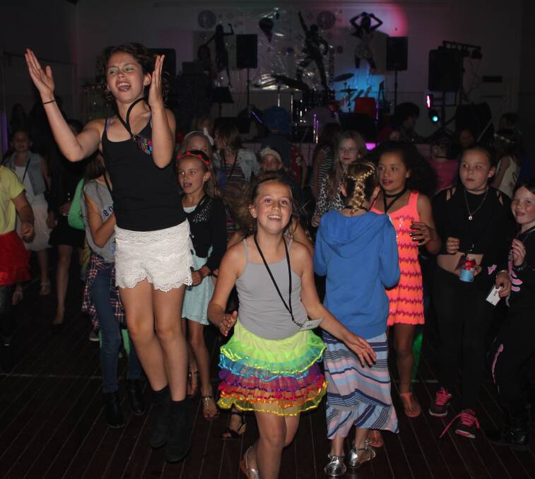 Jumping for joy: Island Bradley and Hannah Forrest enjoy funky beats. Photos: Jen Rice