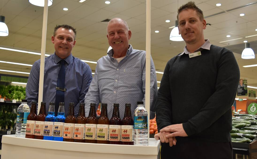 Team effort: Woolworths Margaret River store manager Brett Harrex and Margaret River Beverage Company sales manager Bernard Ryan with Aaron Hood, Woolworth's state local sourcing manager. Photo: Nicky Lefebvre