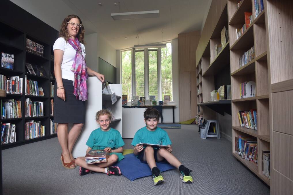 New home: Montessori School principal Lisa Fenton with Tali Gilboa and Cody Maiolo in the new school library. Photo: Nicky Lefebvre