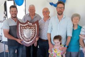 TON UP: Alistair McIlroy, left, from Margaret River Hawks Cricket Club accepts the Yates Shield from Barry House, David Yates, Mike and Hannah Yates and Jenny Yates. Photo supplied.