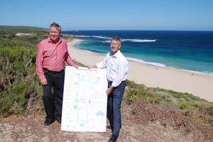 WIND-BLOWN: Premier Colin Barnett and Environment Minister Bill Marmion battle the wind to display a map of the proposed Ngari Capes Marine Park at Rabbit Hill car park, Yallingup, on Saturday.