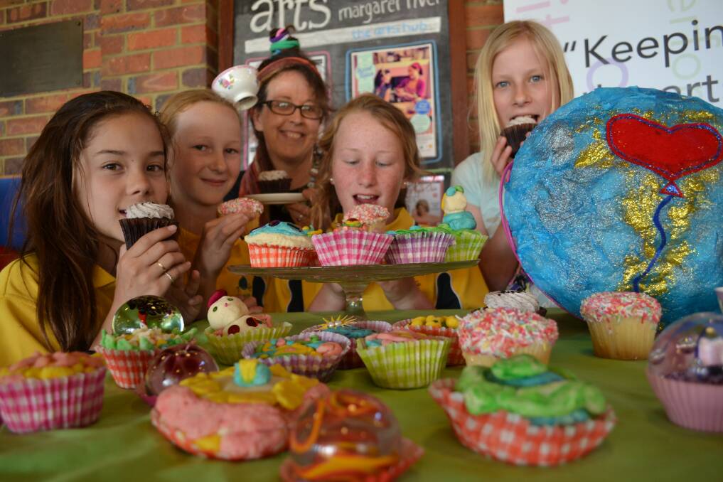 Yummy show awaits: Jade Kreutzer, Emily Simpson, Molly Quick and Georgia Stanlake get ready for Scent Tales and the Margaret River Community Cupcake competition with co-ordinator Margot Edwards.