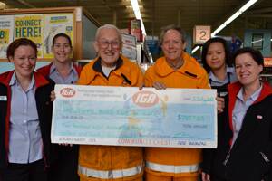 HAPPY HELPERS: IGA’s Kirsti Reed, Bec Downie, Wallcliffe Volunteer Bush Fire Brigade’s Fred Morrison and Ian Dowling, and IGA’s Ivy Kemp and Zett Busby with the cheque for the brigade’s new equipment.