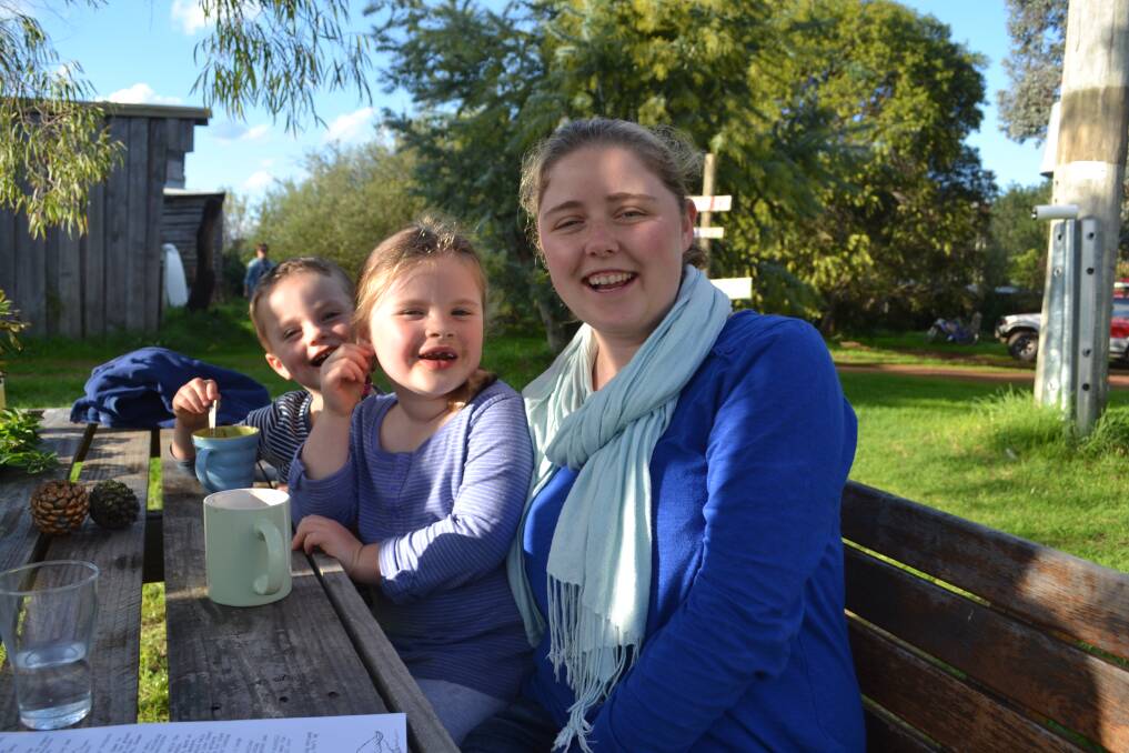 Warm drinks in the sun: William and Caitlin Young with Barbara Quere, who is visiting from overseas.