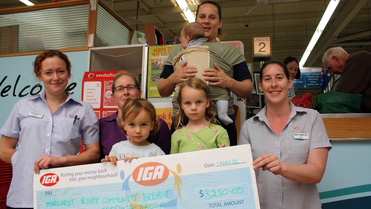 Kirsti Reed of IGA, Donna Livingstone and Andrea Roche of Margaret River Community Breastfeeding Support Group with Caoimhe, 3 months, and Bec Downie of IGA. Up the front, Oscar, 2, and Amelie, 4, help hold the cheque from IGA to the MRCBS group.