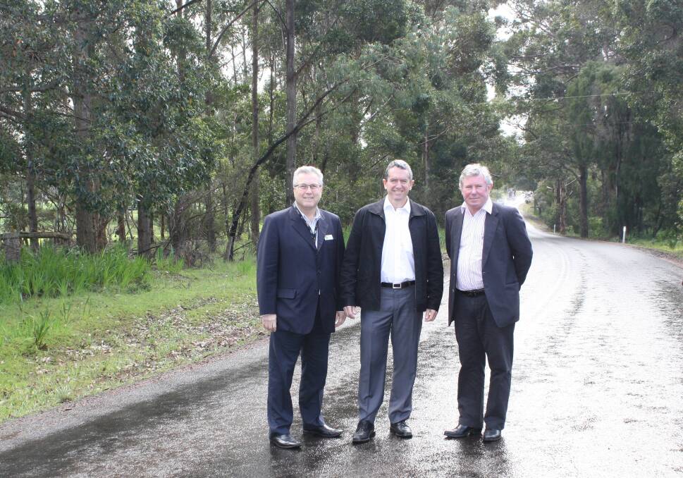 PERIMETER ROAD: Council chief executive officer Gary Evershed, Blackwood Stirling MP Terry Redman and shire president Ray Colyer on Rosa Brook Road for the funding announcement Thursday.