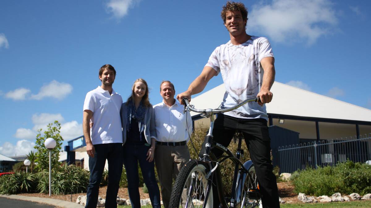 Reunited: Surfpoint's Ben Swanson, Alison Newby and Peter Swanson could not capture the thief but are happy to give Richard Lowe his beloved bike back.