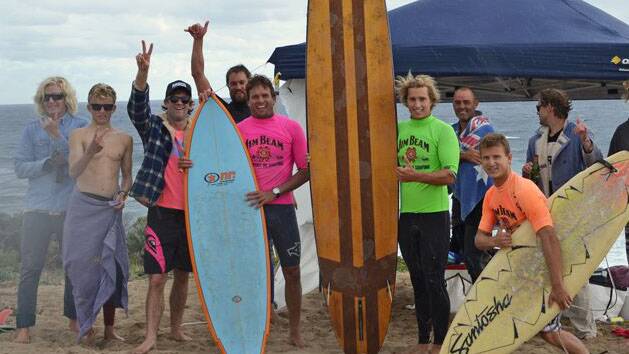 A photo of Chris Boyd, in pink, with Tom Innes behind and some of the other Margaret River Boardriders crew at a Retro Expression Session held by the club. Pic: MRBC