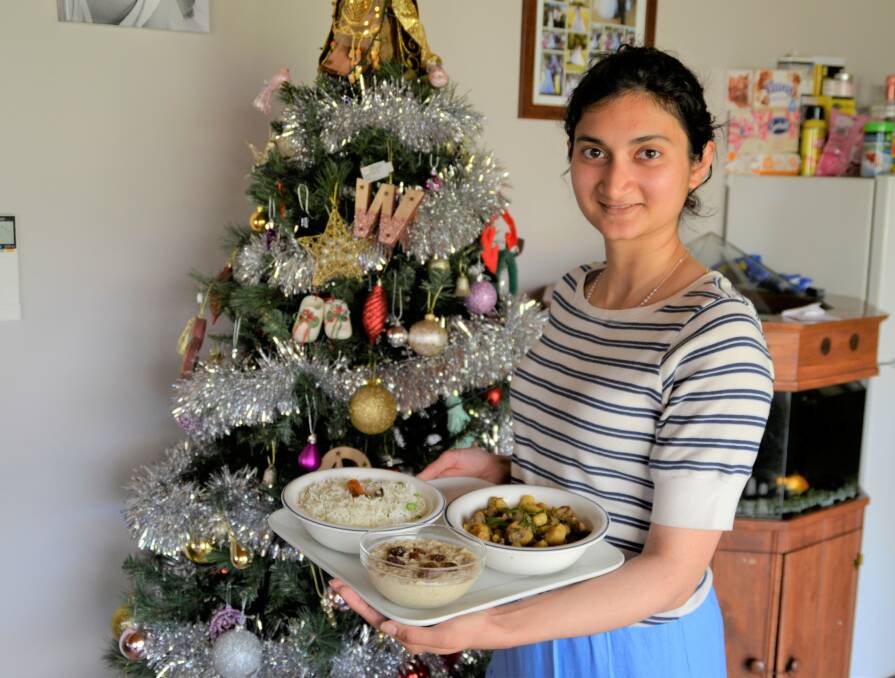 Bengali-Christian Christmas dishes: Marietta Gomes with her traditional beef bhuni, payesh (rice pudding) and peas pulao rice. Photo: Pip Waller 