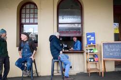 The Tortoise Espresso coffee window in Castlemaine, Victoria with customers waiting patiently. Picture by Brendan McCarthy
